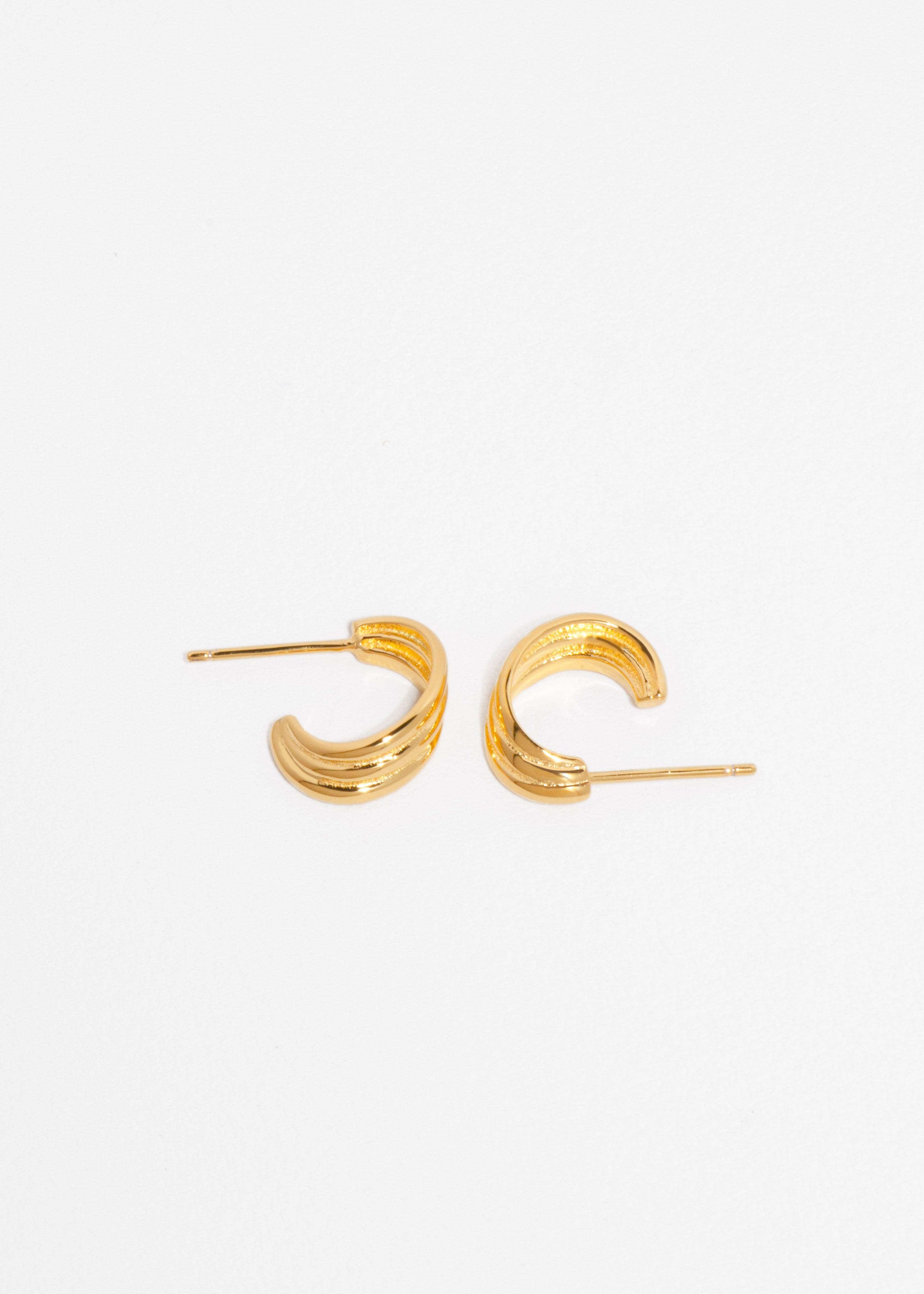 Radiant Curve Huggie Earrings