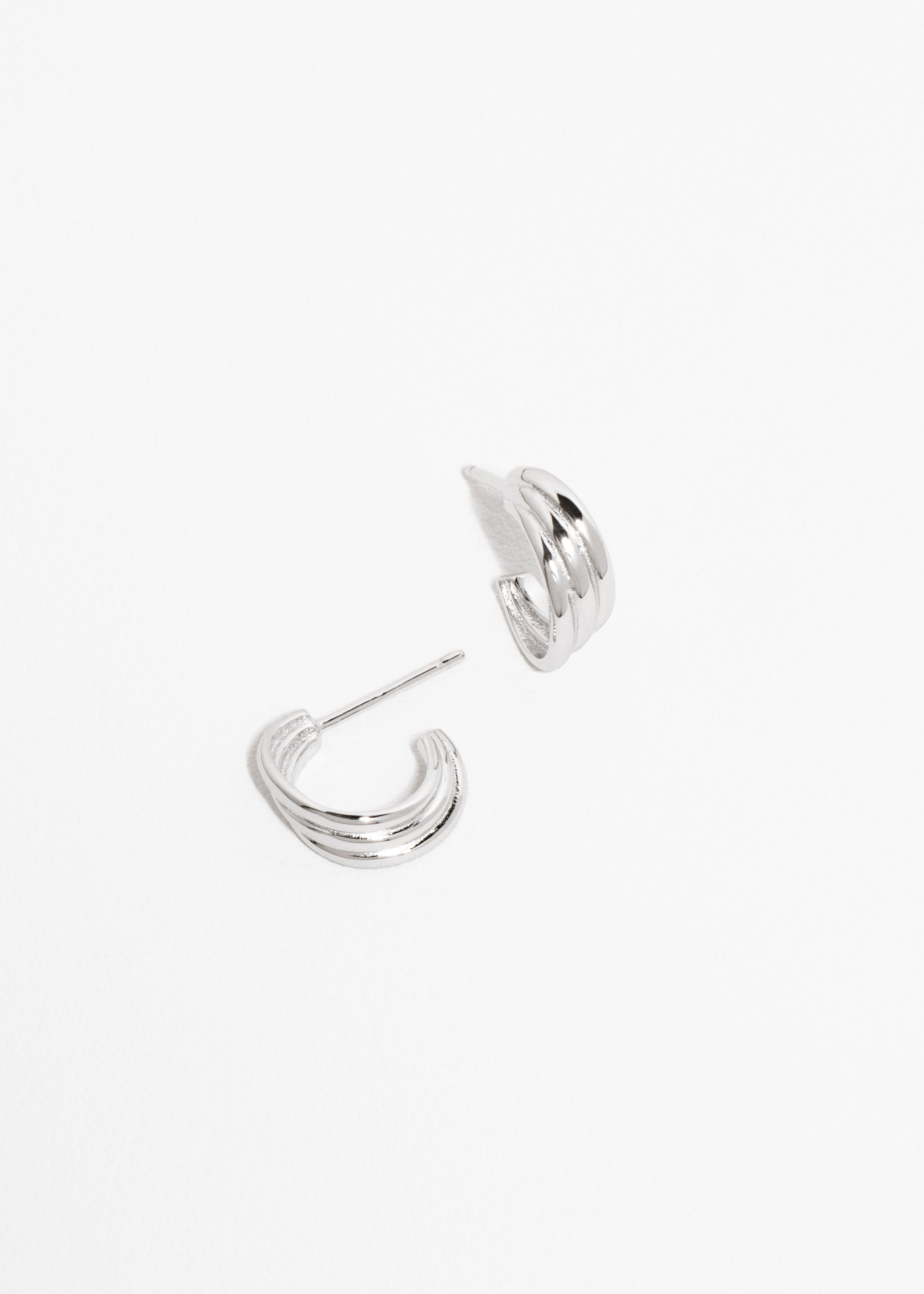 Radiant Curve Huggie Earrings